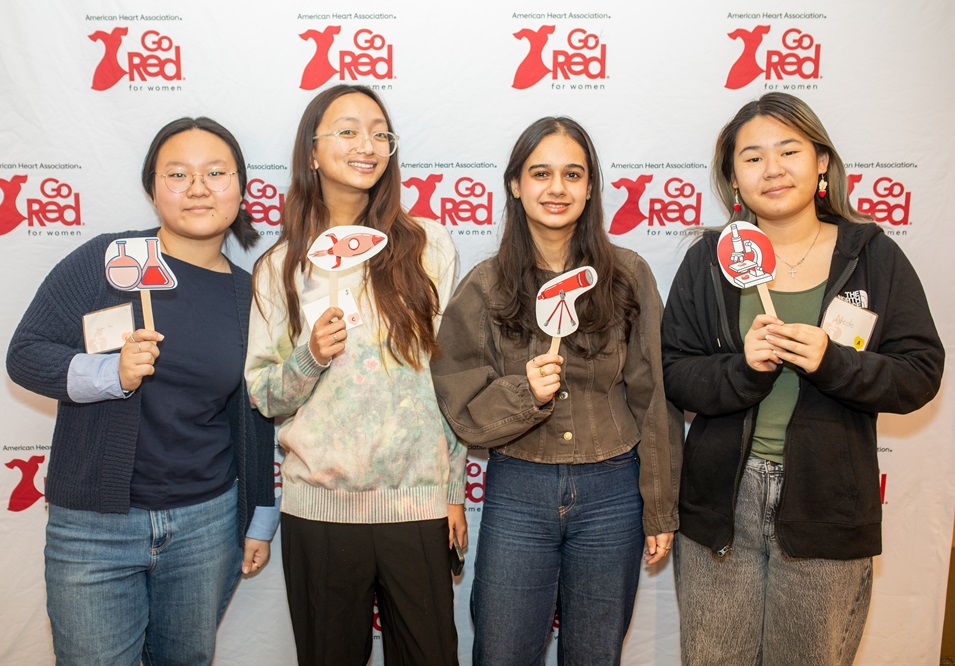 Group of girls learning hands-only C P R.